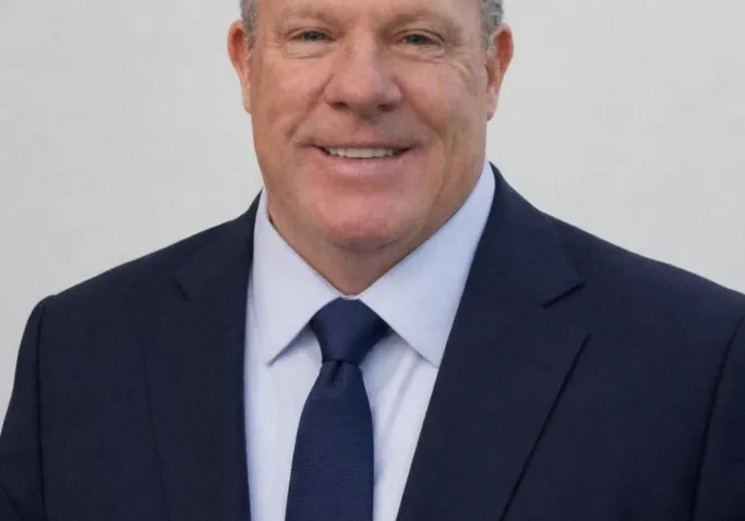 Smiling businessman in navy suit portrait